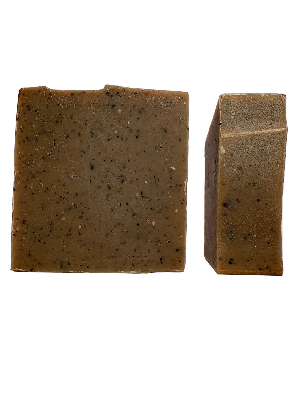 Two brown soap bars with specks of coffee grounds on a white background