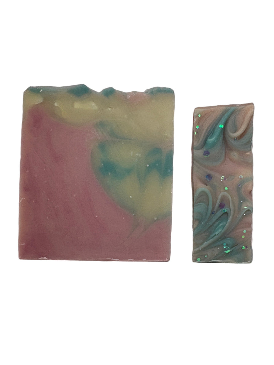 Two colorful soap bars on a white background
