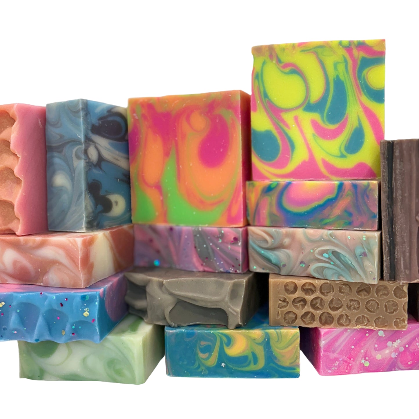 Assorted colorful soap bars on a white background
