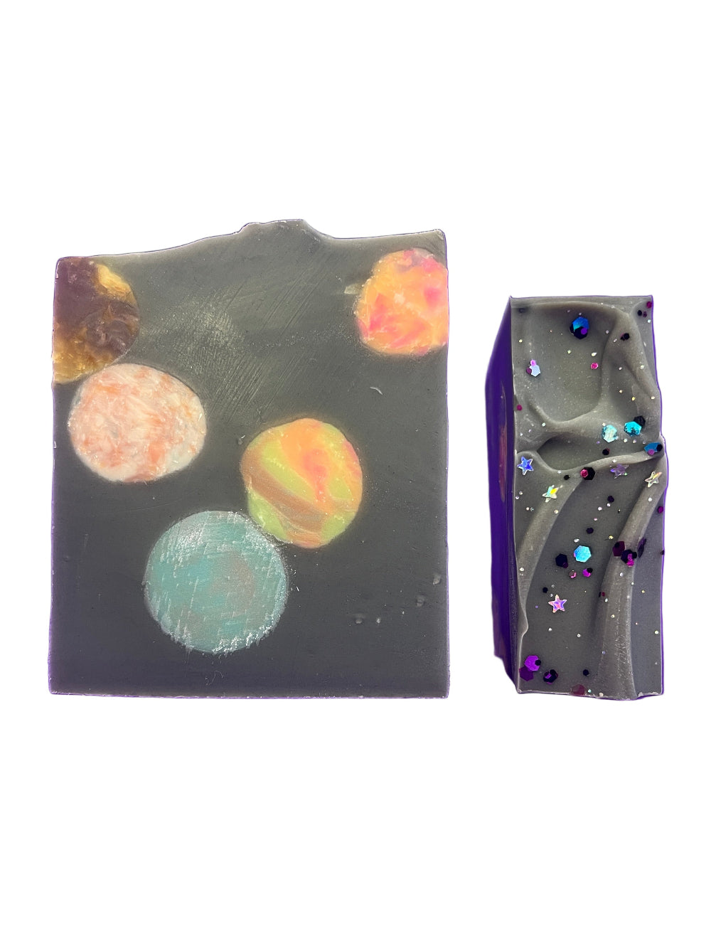 Decorative soap with planet designs on a purple background