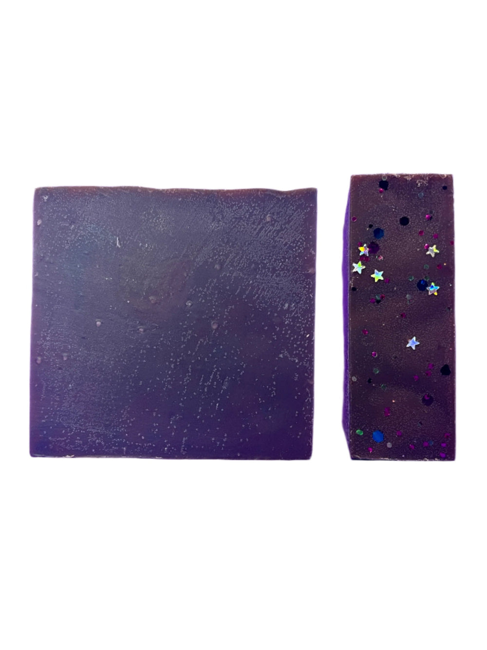 Two purple bar soaps with star-like embellishments on a white background