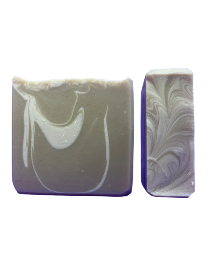 Two marbled soap bars with purple and white swirls on a white background
