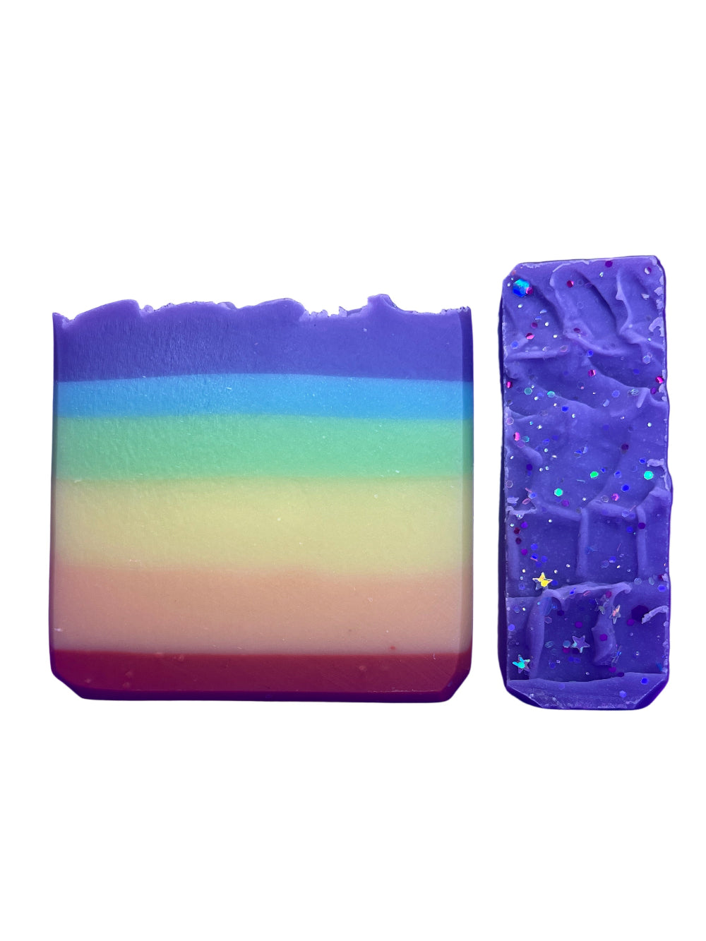 Two colorful rainbow pride soap bars on a white background