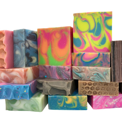 Assorted colorful soap bars on a white background